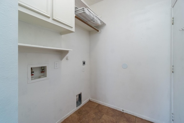 clothes washing area featuring hookup for an electric dryer, cabinets, and hookup for a washing machine