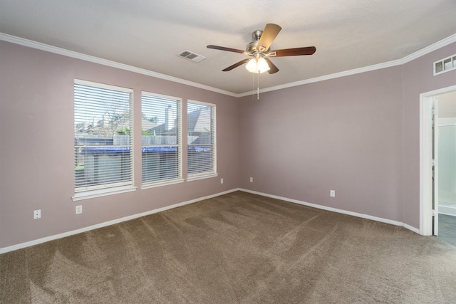 spare room featuring carpet flooring, ceiling fan, and crown molding