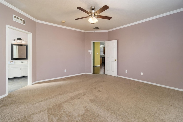 empty room with carpet, ceiling fan, and crown molding