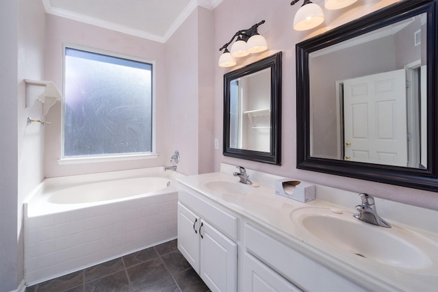 bathroom featuring plenty of natural light, a washtub, crown molding, and vanity