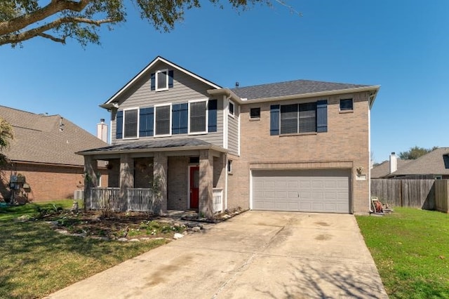 traditional-style house with a garage, covered porch, brick siding, concrete driveway, and a front yard