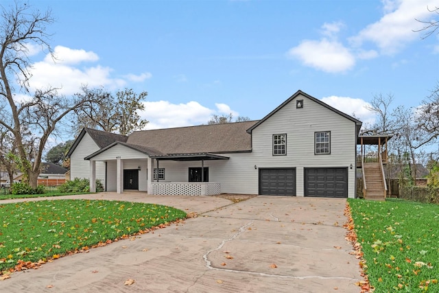 view of front of house featuring a garage and a front yard