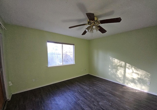 spare room with ceiling fan, dark hardwood / wood-style flooring, and a textured ceiling