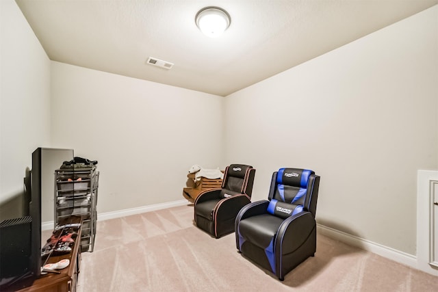 living area with light carpet