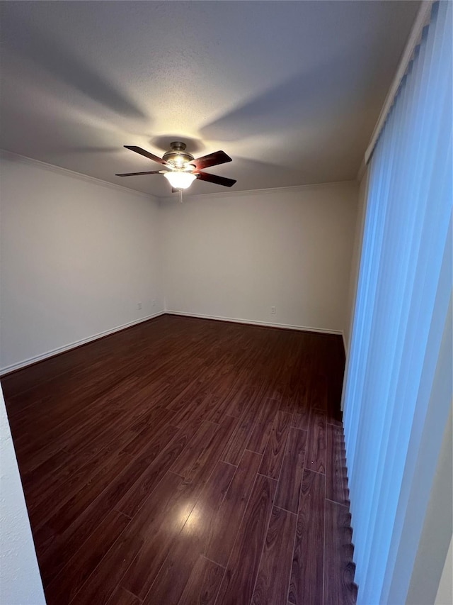 unfurnished room featuring a textured ceiling, dark hardwood / wood-style floors, and ceiling fan