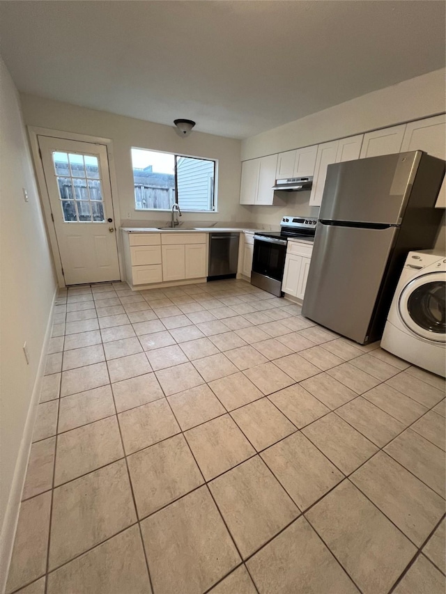 kitchen with white cabinetry, sink, stainless steel appliances, washer / clothes dryer, and light tile patterned flooring