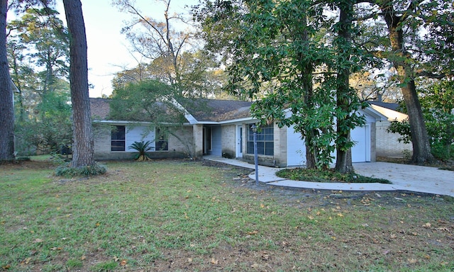 single story home with a front yard and a garage