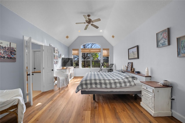 bedroom featuring vaulted ceiling, light hardwood / wood-style flooring, and ceiling fan