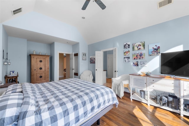 bedroom with ceiling fan, wood-type flooring, and lofted ceiling