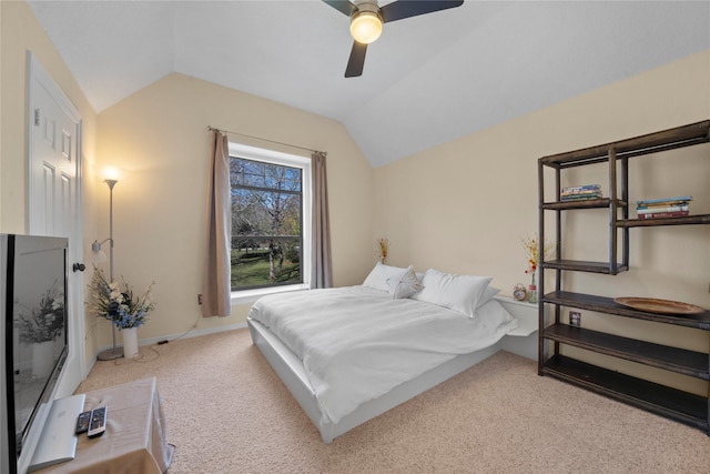 bedroom featuring ceiling fan, light colored carpet, and lofted ceiling