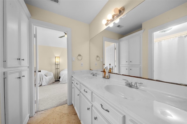 bathroom with ceiling fan and vanity