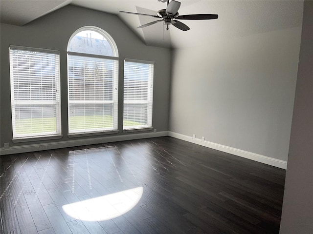 unfurnished room featuring ceiling fan, vaulted ceiling, and dark hardwood / wood-style flooring