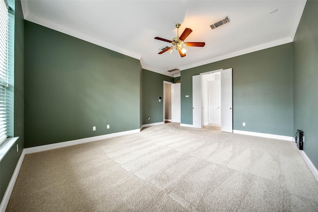 unfurnished bedroom with carpet flooring, ceiling fan, and ornamental molding