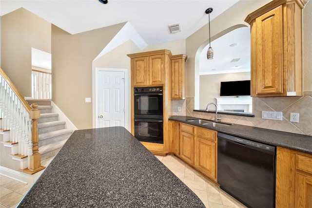 kitchen featuring decorative backsplash, sink, light tile patterned flooring, and black appliances