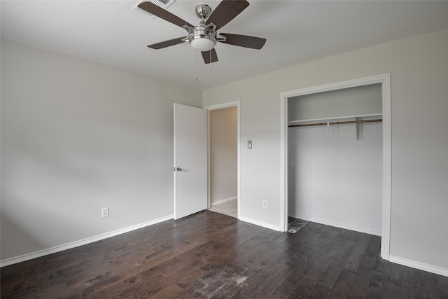 unfurnished bedroom with a closet, ceiling fan, and dark wood-type flooring