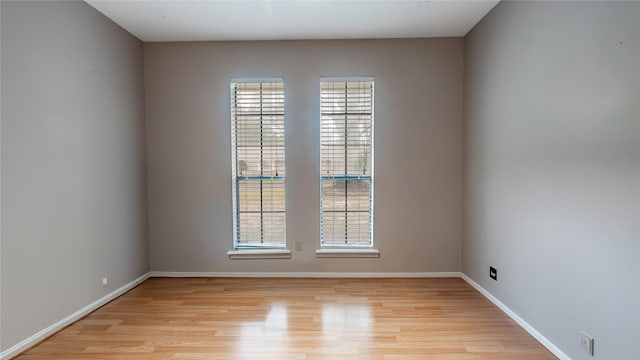 spare room featuring light wood-type flooring