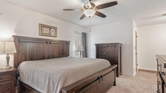 bedroom featuring light carpet and ceiling fan