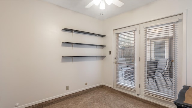 empty room with carpet flooring and ceiling fan