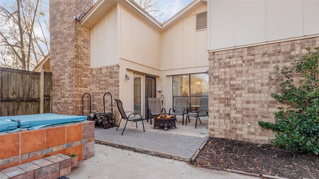 view of patio featuring an outdoor fire pit