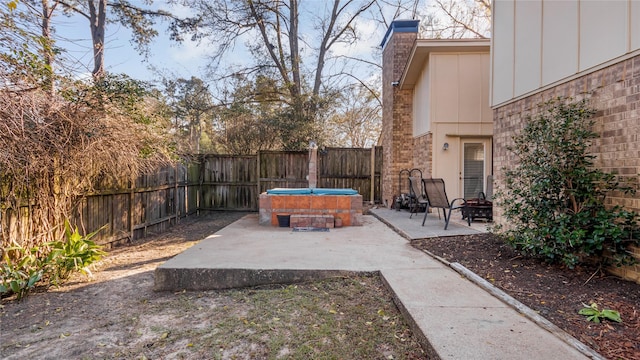 view of patio / terrace with a jacuzzi