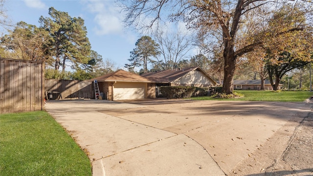 view of front of house with a front lawn and a garage