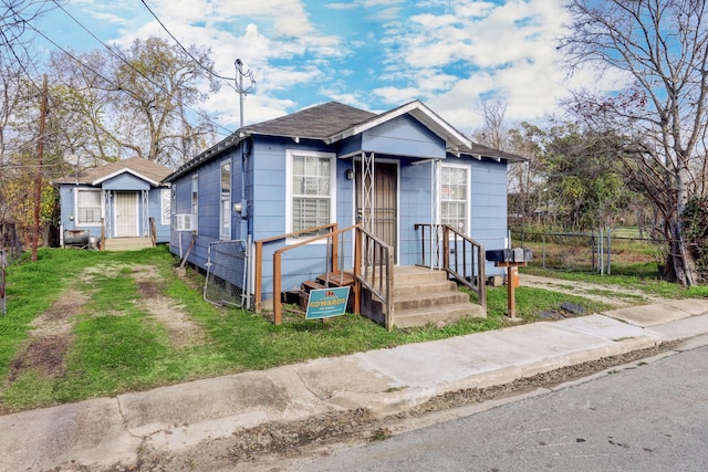 bungalow with a front yard