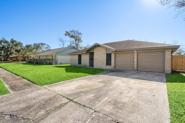 ranch-style home with a garage and a front lawn