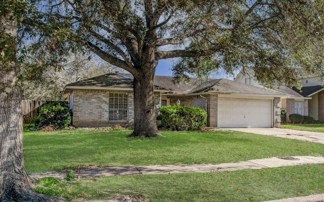 ranch-style house featuring a front yard and a garage