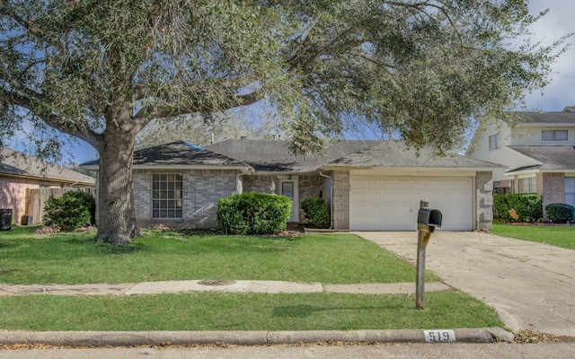 view of front of house with a front yard and a garage