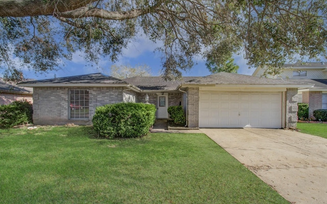 ranch-style home featuring a front yard and a garage