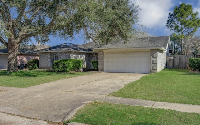 ranch-style house featuring a garage and a front yard