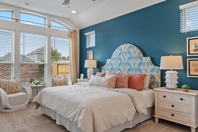 carpeted bedroom with vaulted ceiling