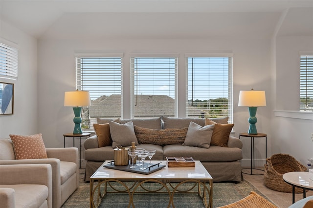 living room featuring lofted ceiling