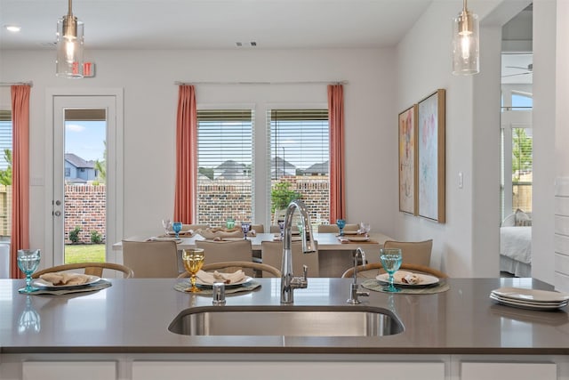 kitchen featuring sink and decorative light fixtures