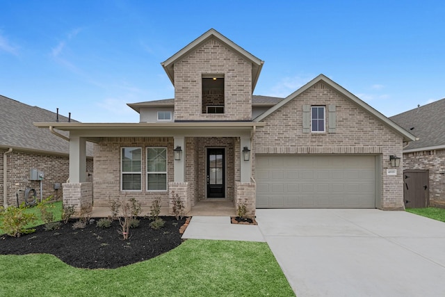 view of front of home with a garage and a front yard