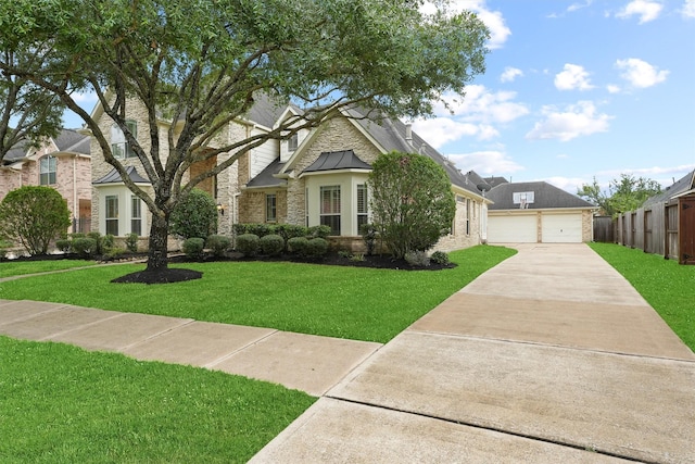 view of front of home with a front lawn and a garage