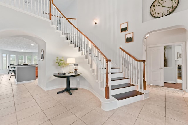 staircase with tile patterned flooring