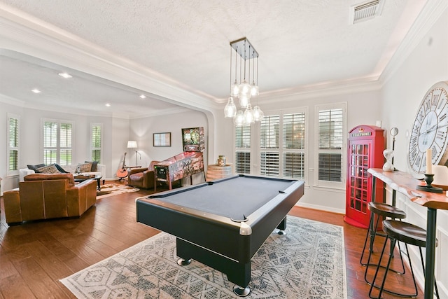 rec room featuring a textured ceiling, crown molding, wood-type flooring, an inviting chandelier, and billiards