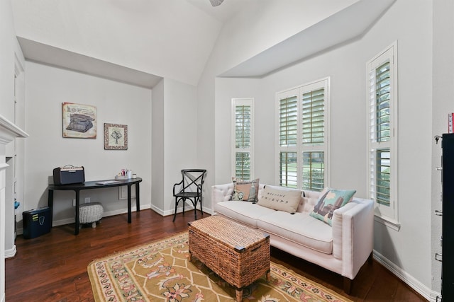 living room with dark hardwood / wood-style floors and lofted ceiling