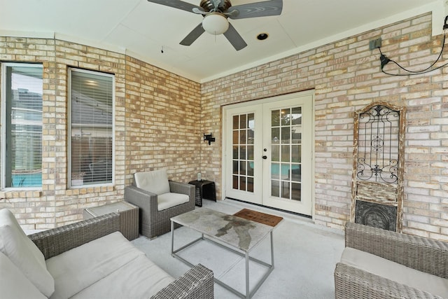 view of patio / terrace featuring french doors, an outdoor living space, and ceiling fan