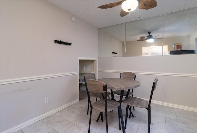 dining room with light tile patterned floors and a textured ceiling