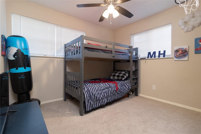 bedroom with light colored carpet and ceiling fan