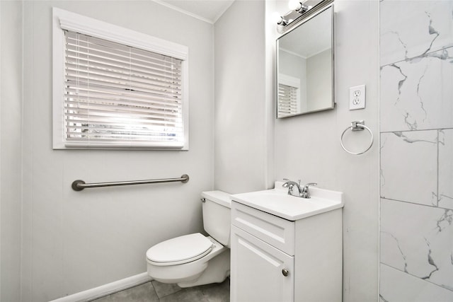 bathroom with tile patterned flooring, vanity, and toilet