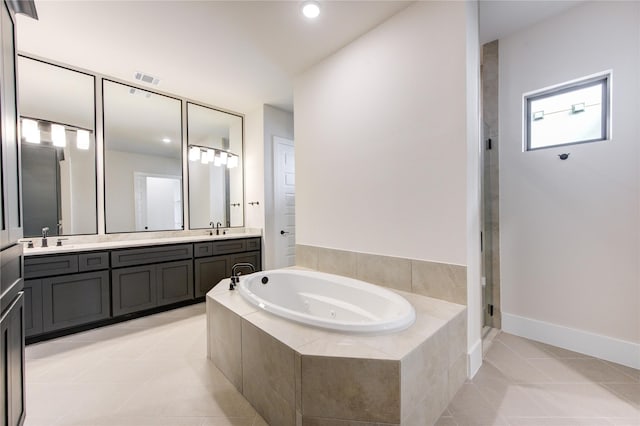 bathroom with tile patterned flooring, vanity, and independent shower and bath