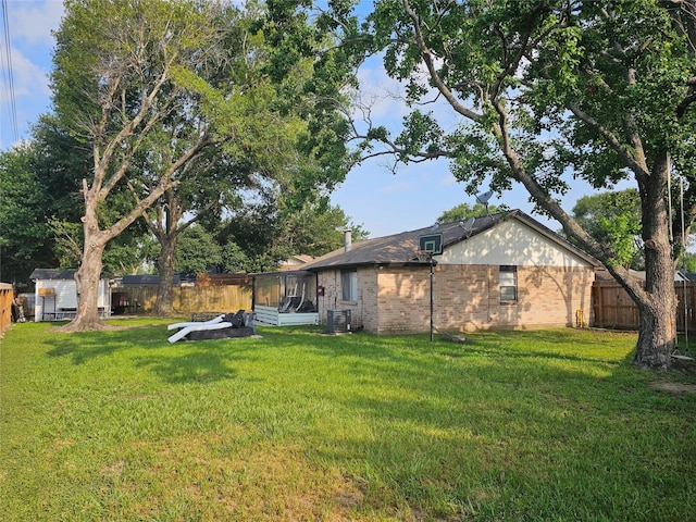 view of yard with central AC unit