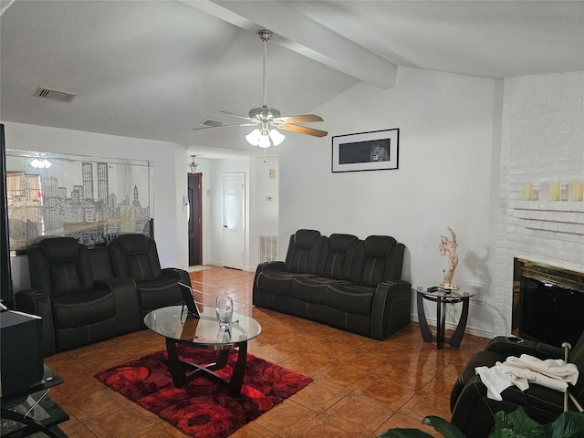 tiled living room featuring vaulted ceiling with beams, a brick fireplace, and ceiling fan