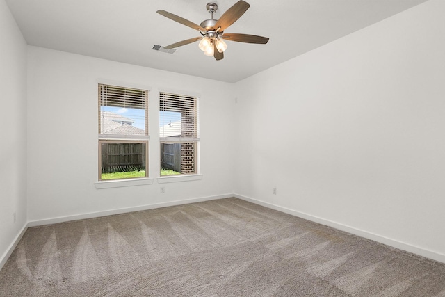 carpeted empty room featuring ceiling fan