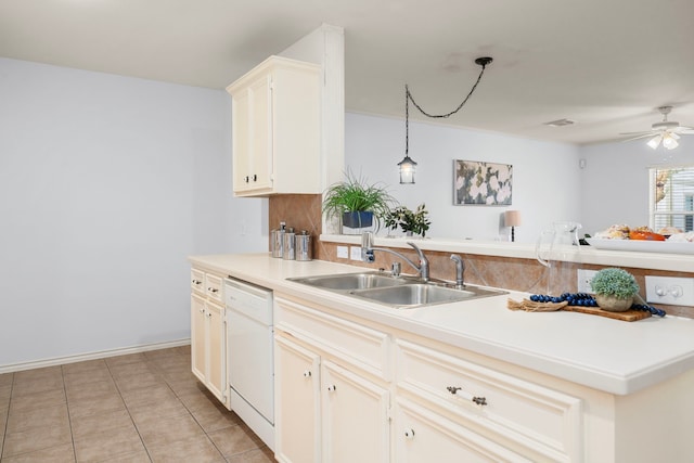 kitchen featuring decorative light fixtures, dishwasher, sink, light tile patterned floors, and ceiling fan