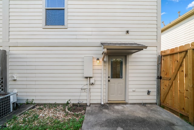 doorway to property featuring a patio and central air condition unit