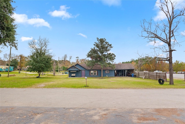 ranch-style home with a front lawn